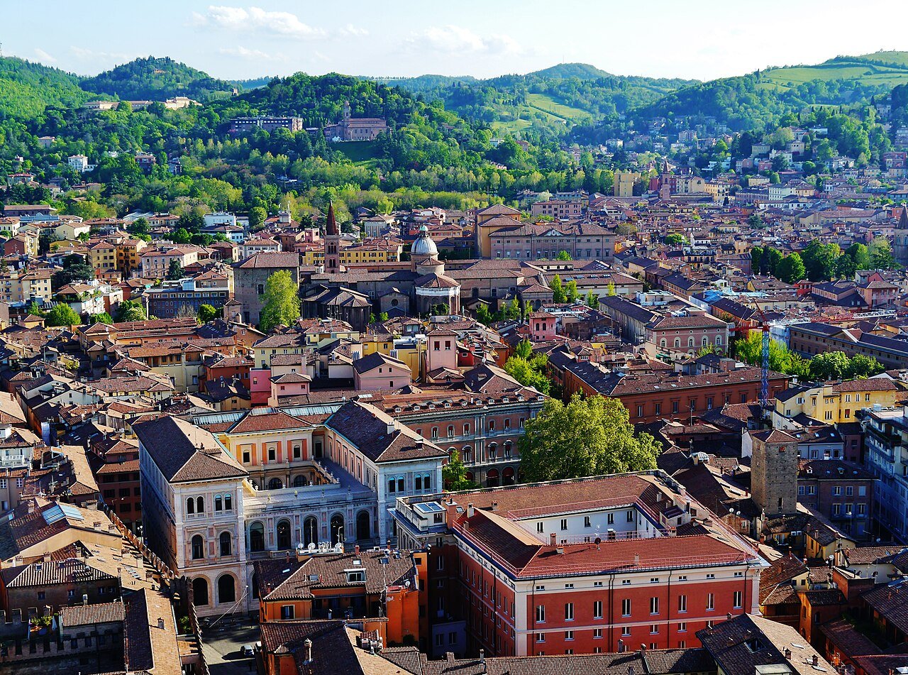 Bologna's red roofs seen from the top of the Torre degli Asinelli, running south to the green hills
